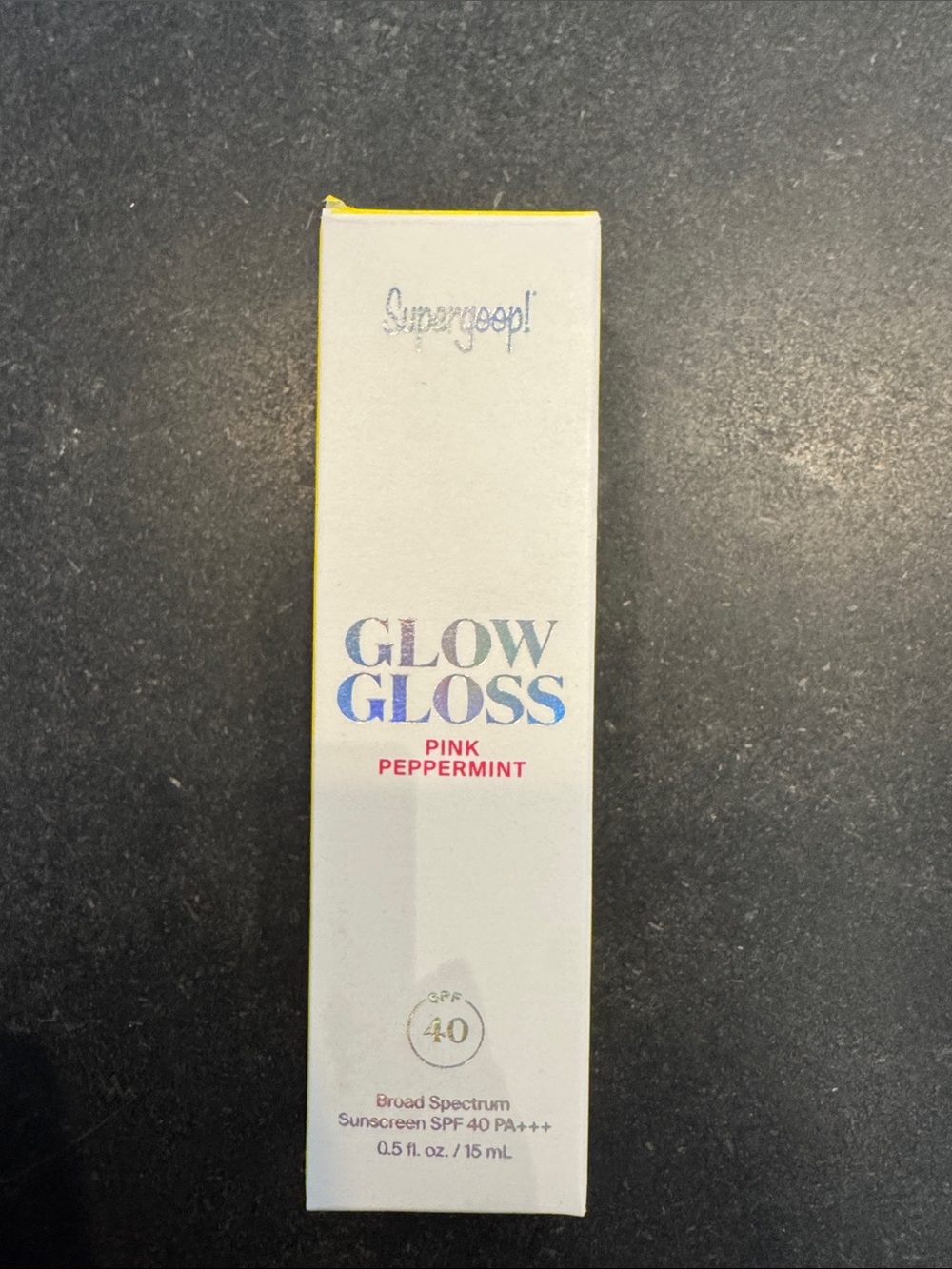 Supergoop! Glow Gloss Lip Treatment — Pink Peppermint with Yellow Accents